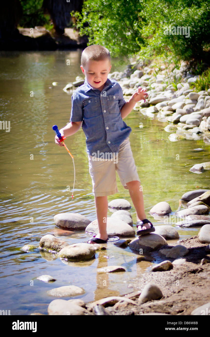 Boy with fishing pole hi-res stock photography and images - Alamy