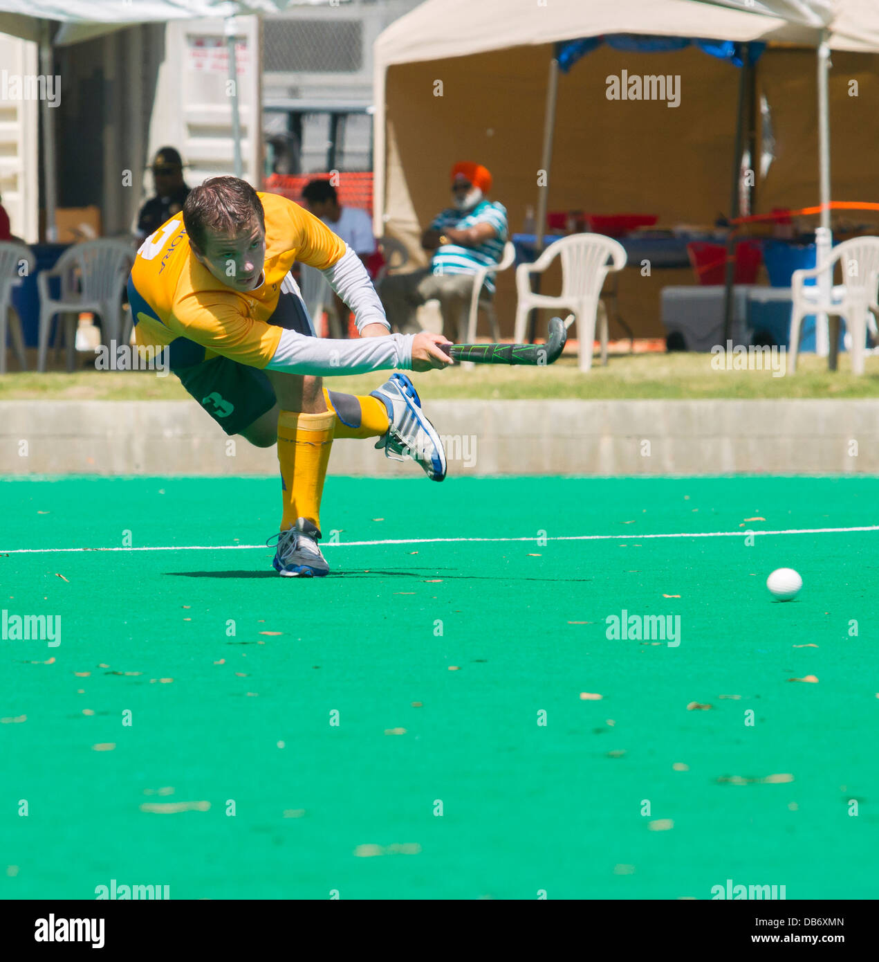 Athlete striking the ball at the California Cup Field Hockey tournament