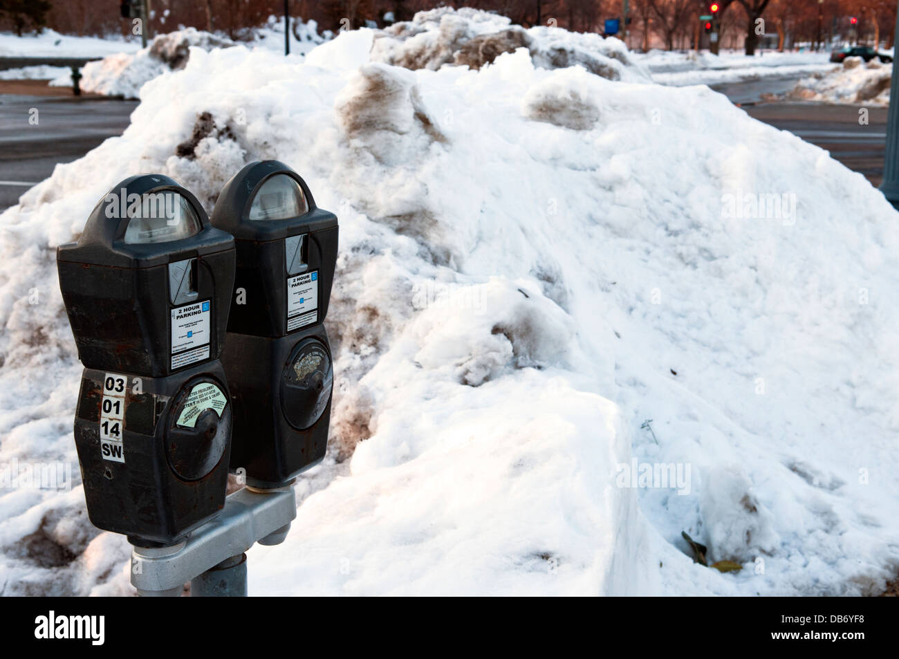 Snow piled up by parking meters in Washington DC Stock Photo