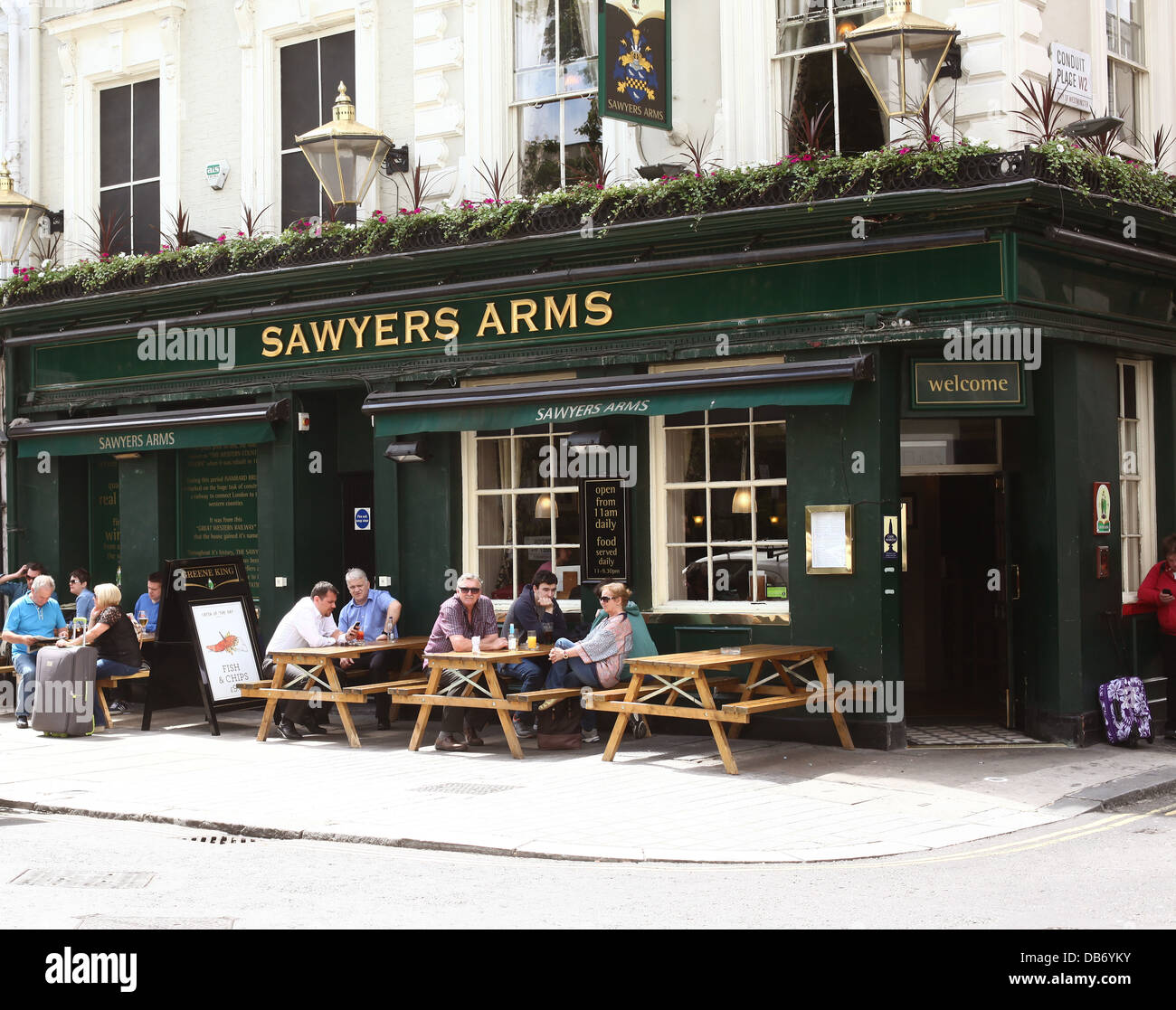 Sawyers Arms, a pub in Central London with drinkers outside in the sun enjoying their pints, near Paddington Station, July 2013 Stock Photo