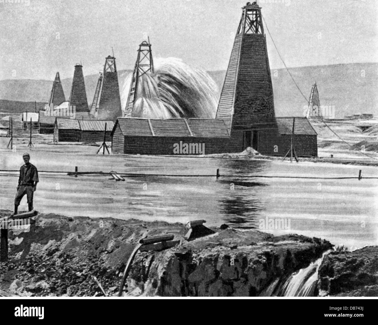 energy, petroleum, oil well, Baku, after a photograph, wood engraving, late 19th century, 19th century, 20th century, Russia, Azerbaijan, crude oil, crude naphtha, raw oil, base oil, rock oil, crude petroleum, oil, resource, raw material, raw materials, crude materials, historic, historical, Baki, Bakou, compressure, compression, pression, thrust, fountain, fountains, drilling derrick, wellhead, boring tower, boring trestle, drill tower, drill rig, drilling derricks, wellheads, boring towers, boring trestles, drill towers, drill rigs, people, Additional-Rights-Clearences-Not Available Stock Photo