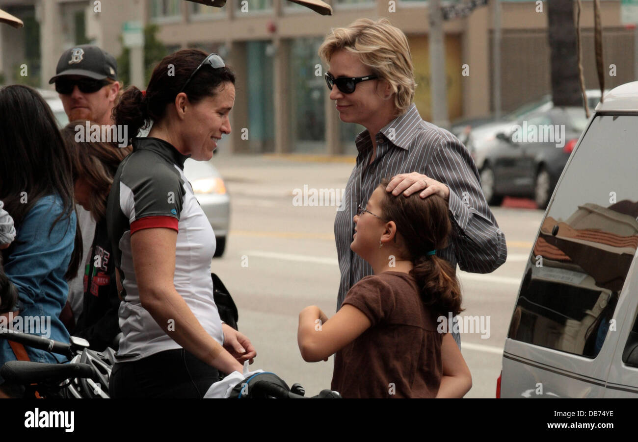Jane Lynch, wife Dr. Lara Embry and her daughter Haden chat on the sidewalk while out for
