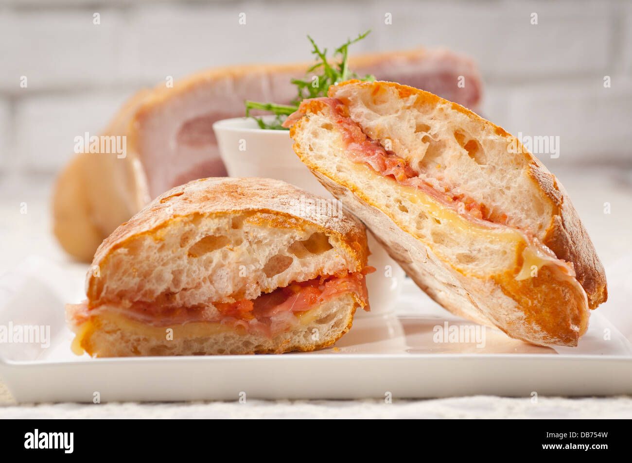 Italian ciabatta panini sandwich with parma ham and tomato Stock Photo ...