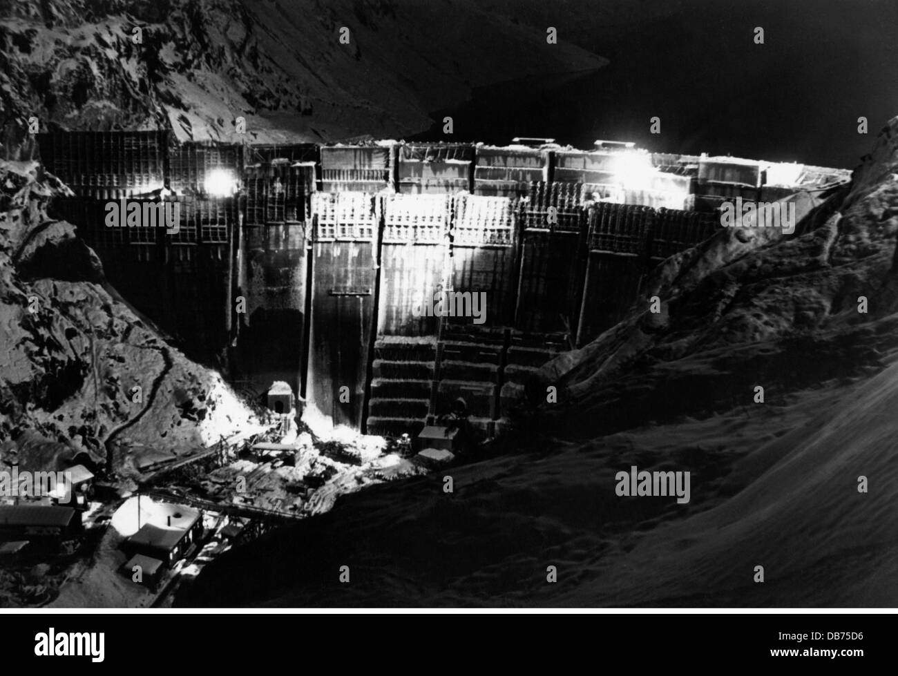 energy, water, Limberg dam of the Kaprun power station during construction, night view, Austria, circa 1950, Additional-Rights-Clearences-Not Available Stock Photo