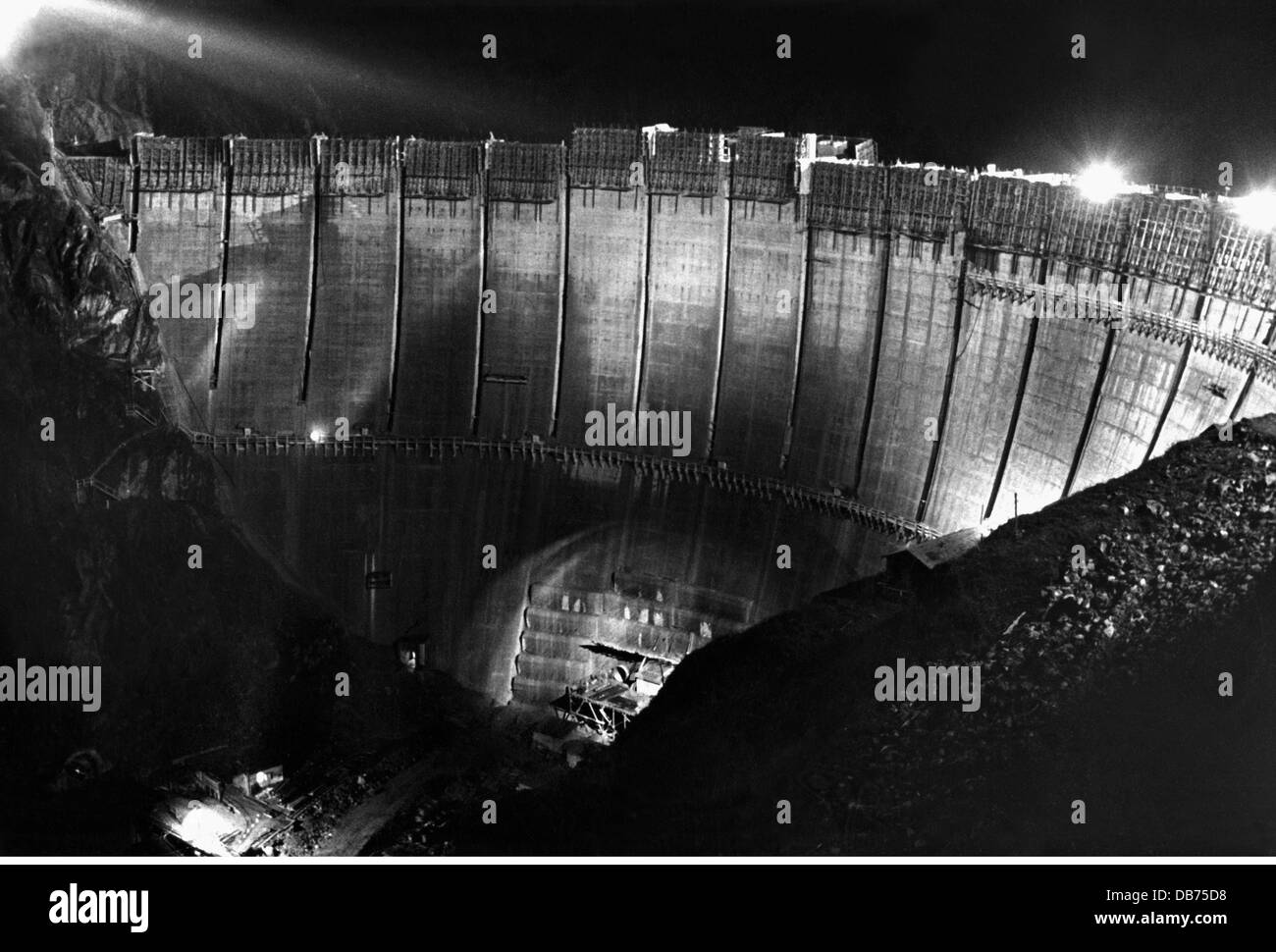 energy, water, Limberg dam of the Kaprun power station during construction, night view, Austria, circa 1950, Additional-Rights-Clearences-Not Available Stock Photo