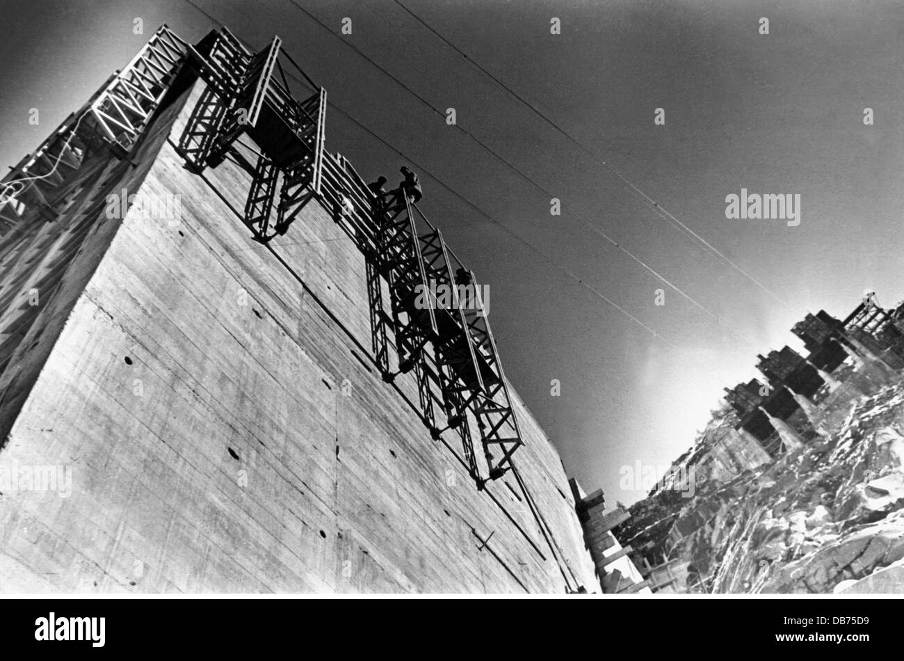 energy, water, worker on scaffold at the Limberg dam of the Kaprun power station, Austria, circa 1950, Additional-Rights-Clearences-Not Available Stock Photo