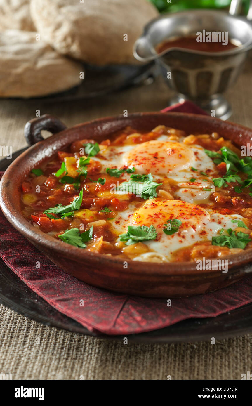 Shakshuka. Eggs in a spicy tomato and pepper sauce. Stock Photo
