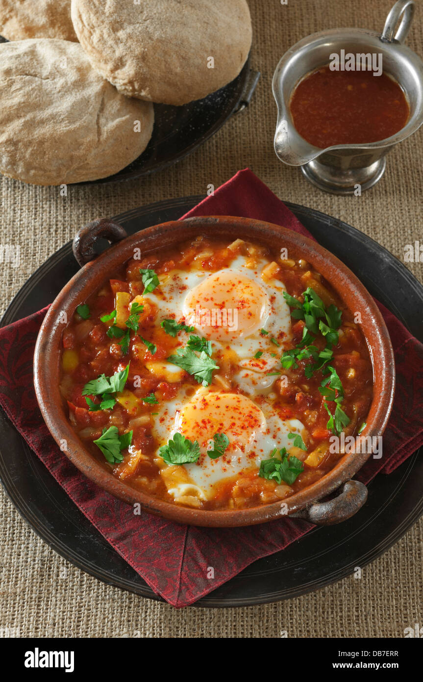 Shakshuka. Eggs in a spicy tomato and pepper sauce. Stock Photo