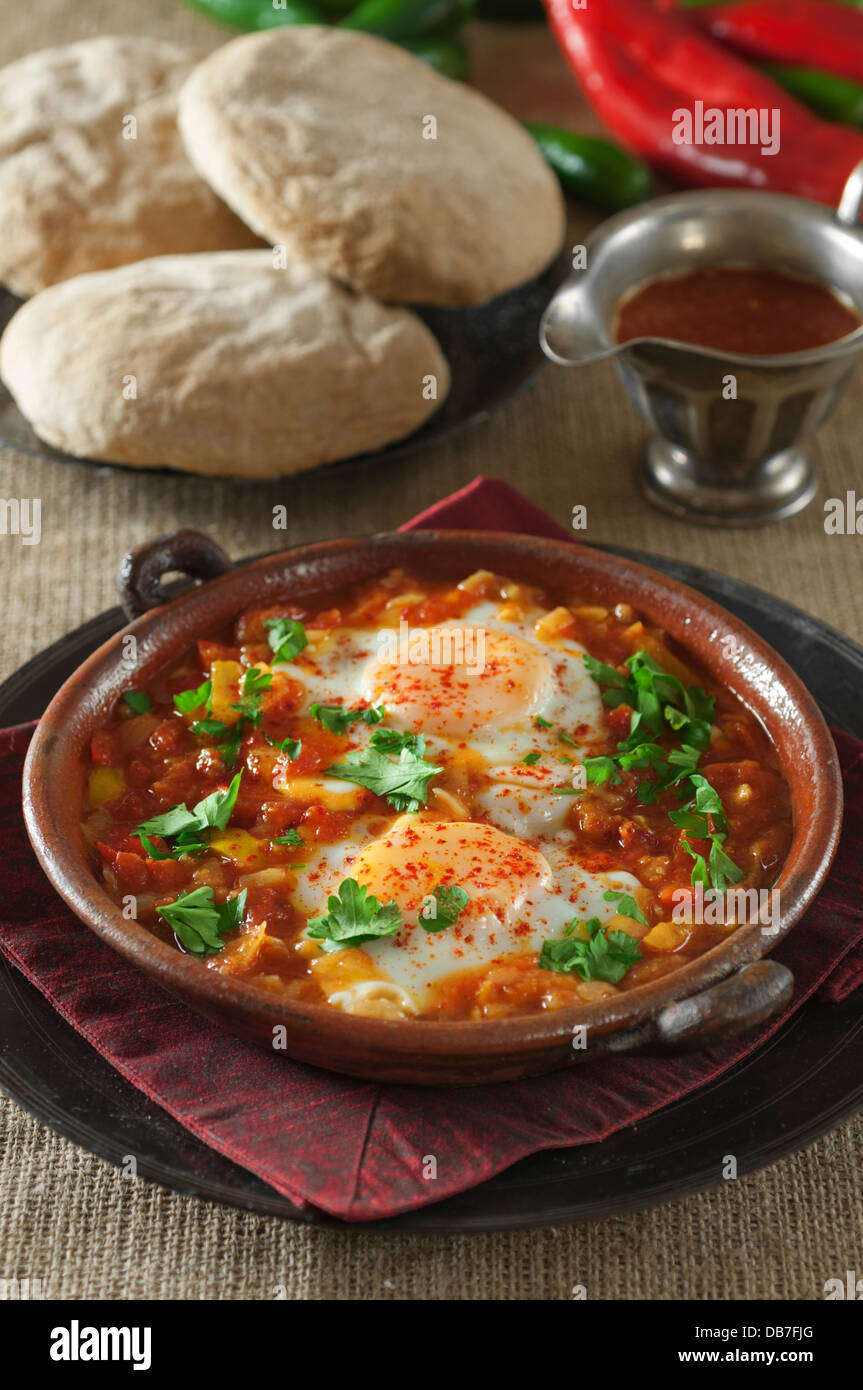 Shakshuka. Eggs in a spicy tomato and pepper sauce. Stock Photo