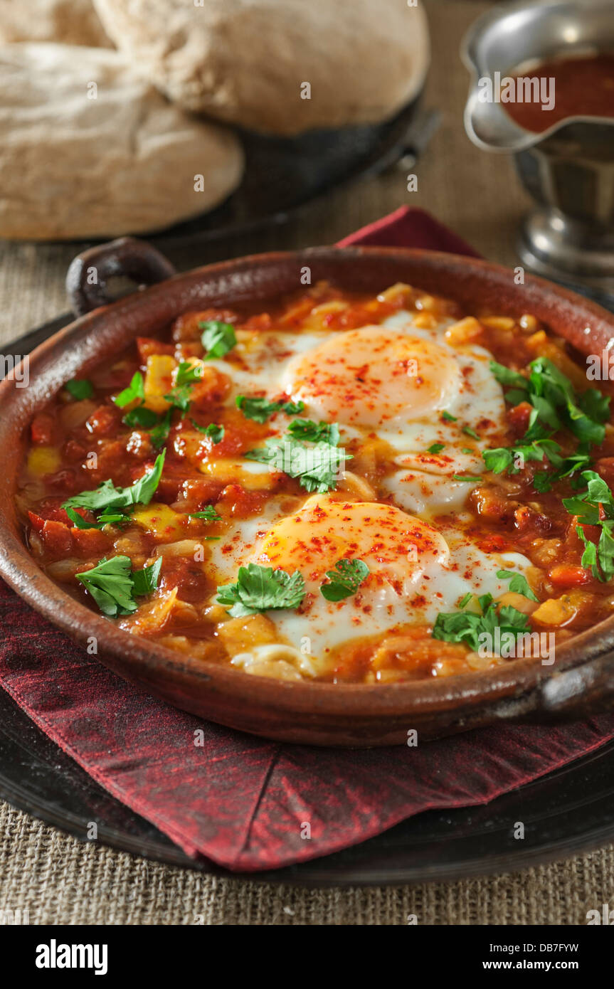 Shakshuka. Eggs in a spicy tomato and pepper sauce. Stock Photo