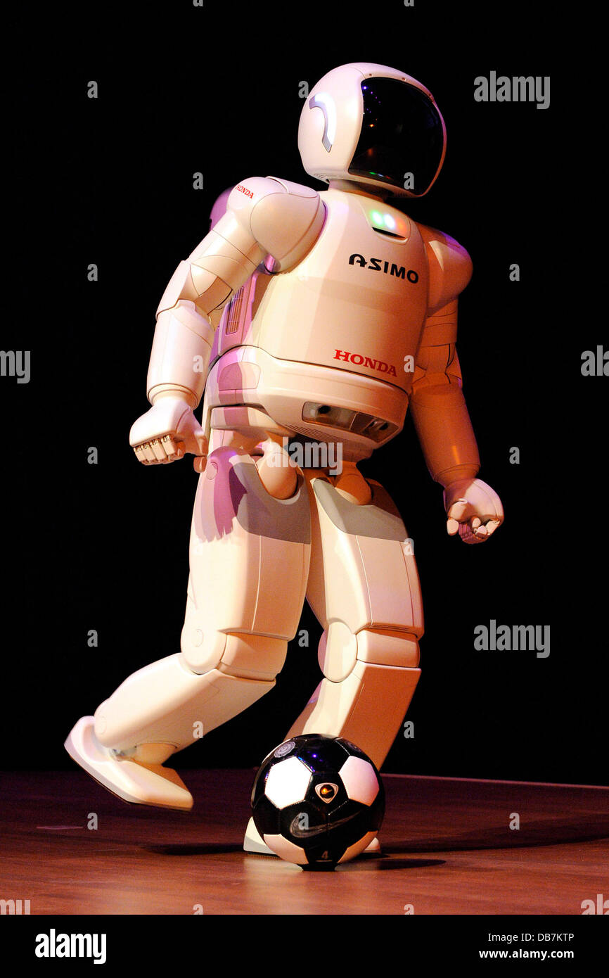 Honda's ASIMO robot performs walking, running, dancing, climbing stairs, and kicking a soccer ball at a special presentation at Ontario Science Centre. Toronto, Canada - 13.05.11 Stock Photo