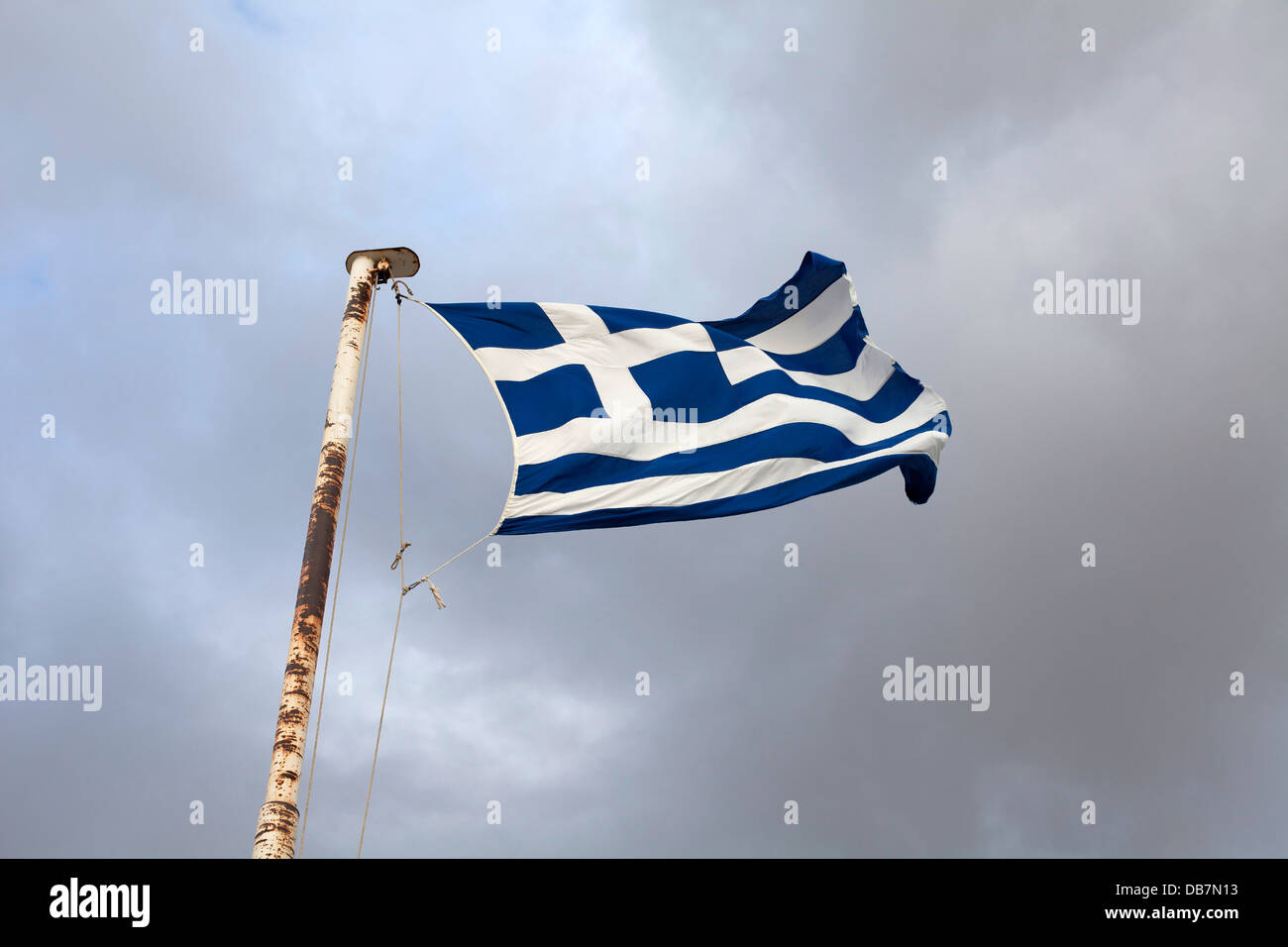 Greek flag flying in stormy  conditions in Athens, Greece Stock Photo