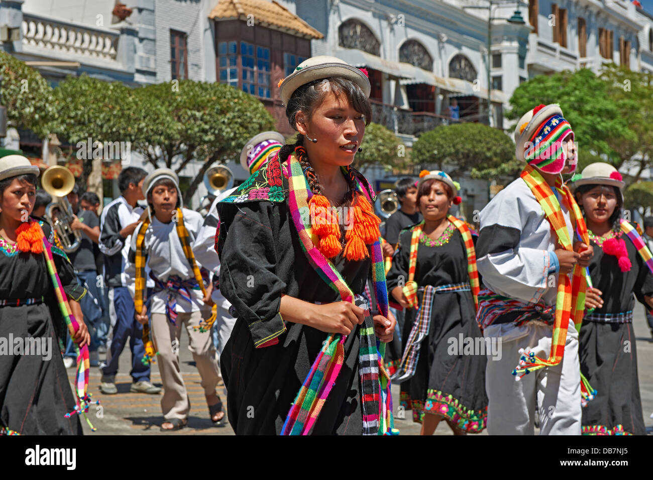 indigenous people with traditional costumes dancing in the street of Sucre, Bolivia, South America Stock Photo