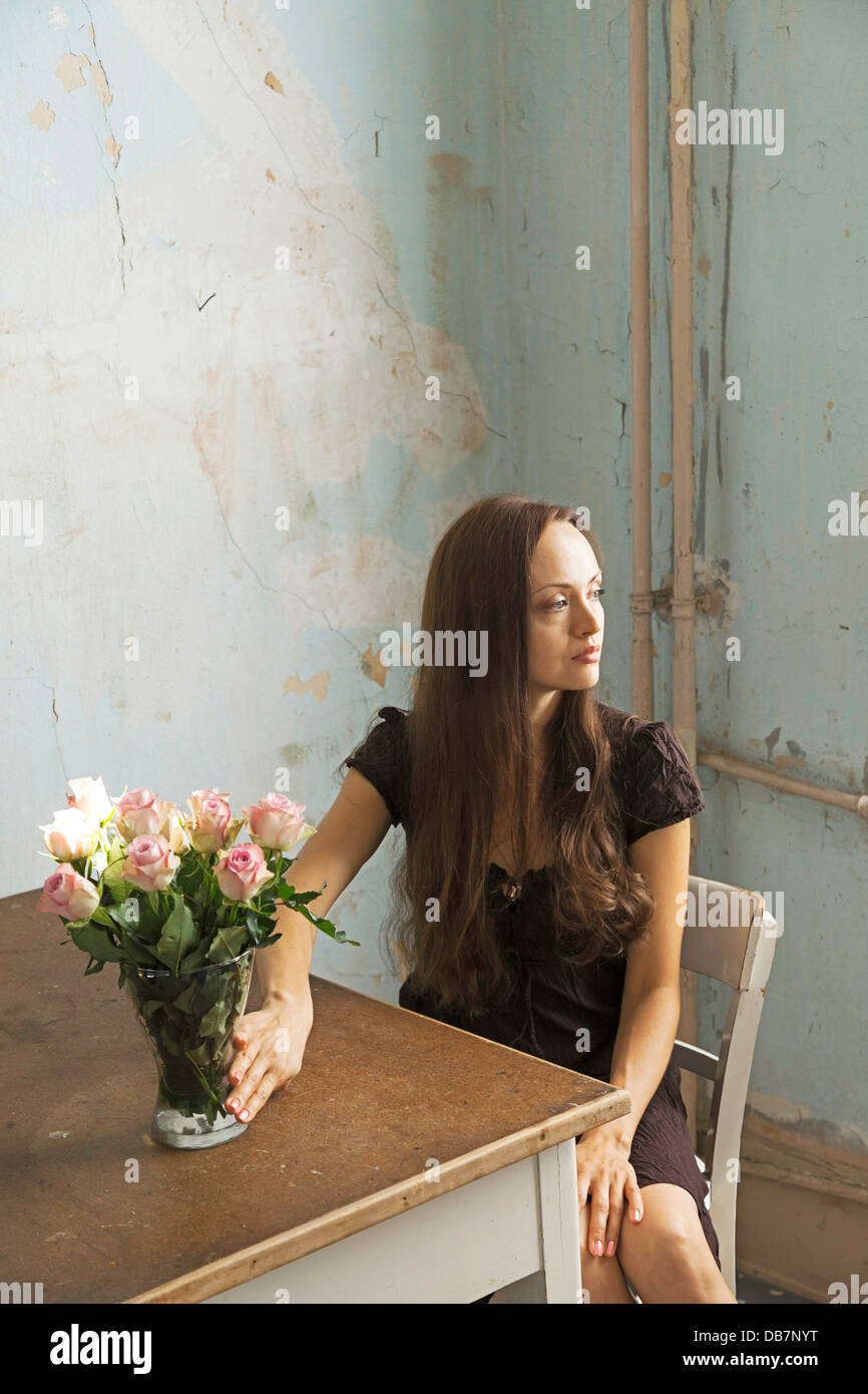 Premium Photo  Pensive woman sitting at table while thinking