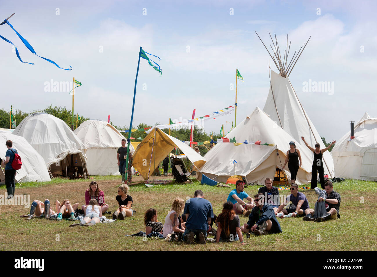 Glastonbury Festival 2013 - Festival goers relax in the Healing Field. Stock Photo
