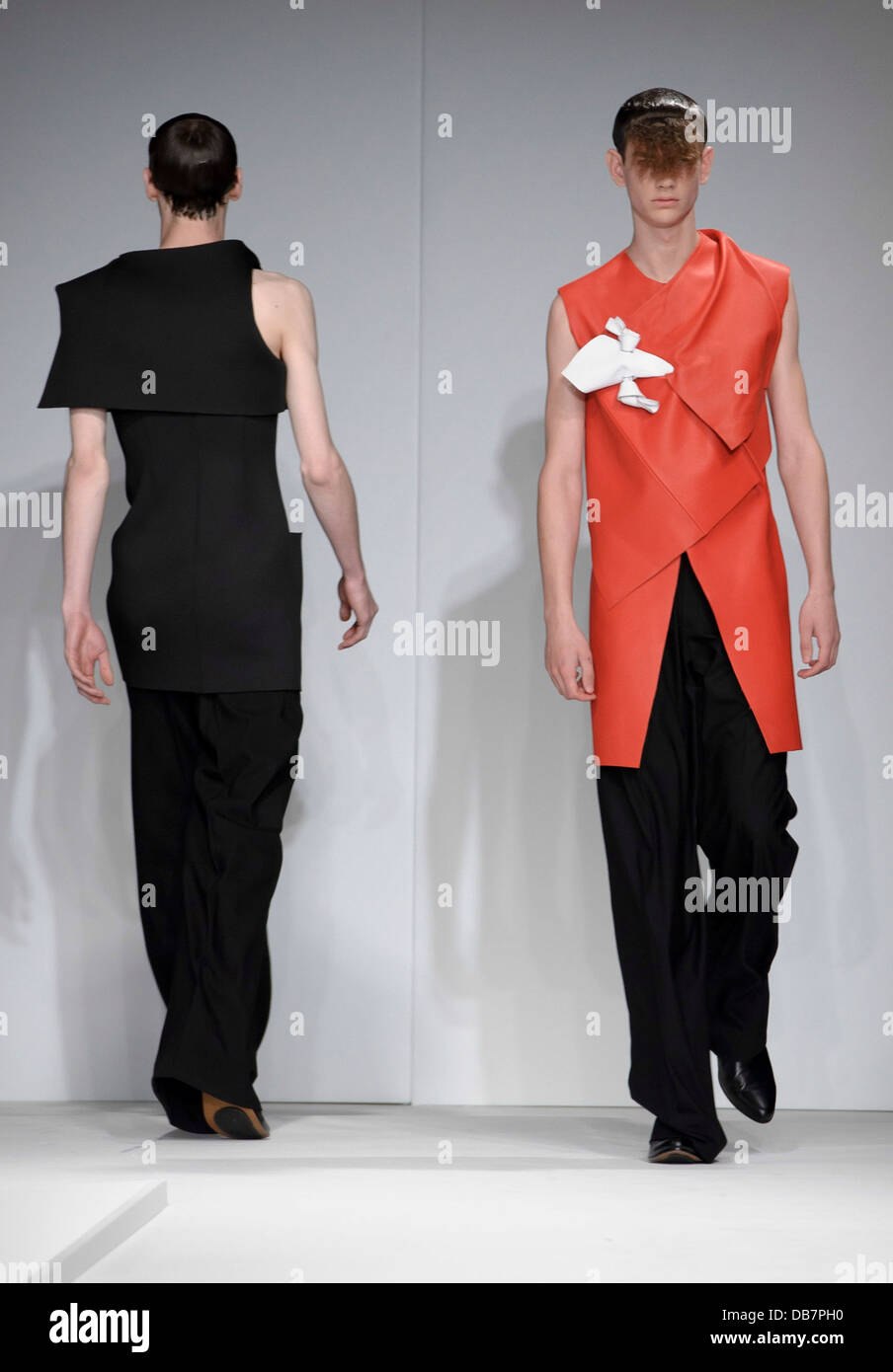 Models wear a design from the J.W. Anderson collection during London ...