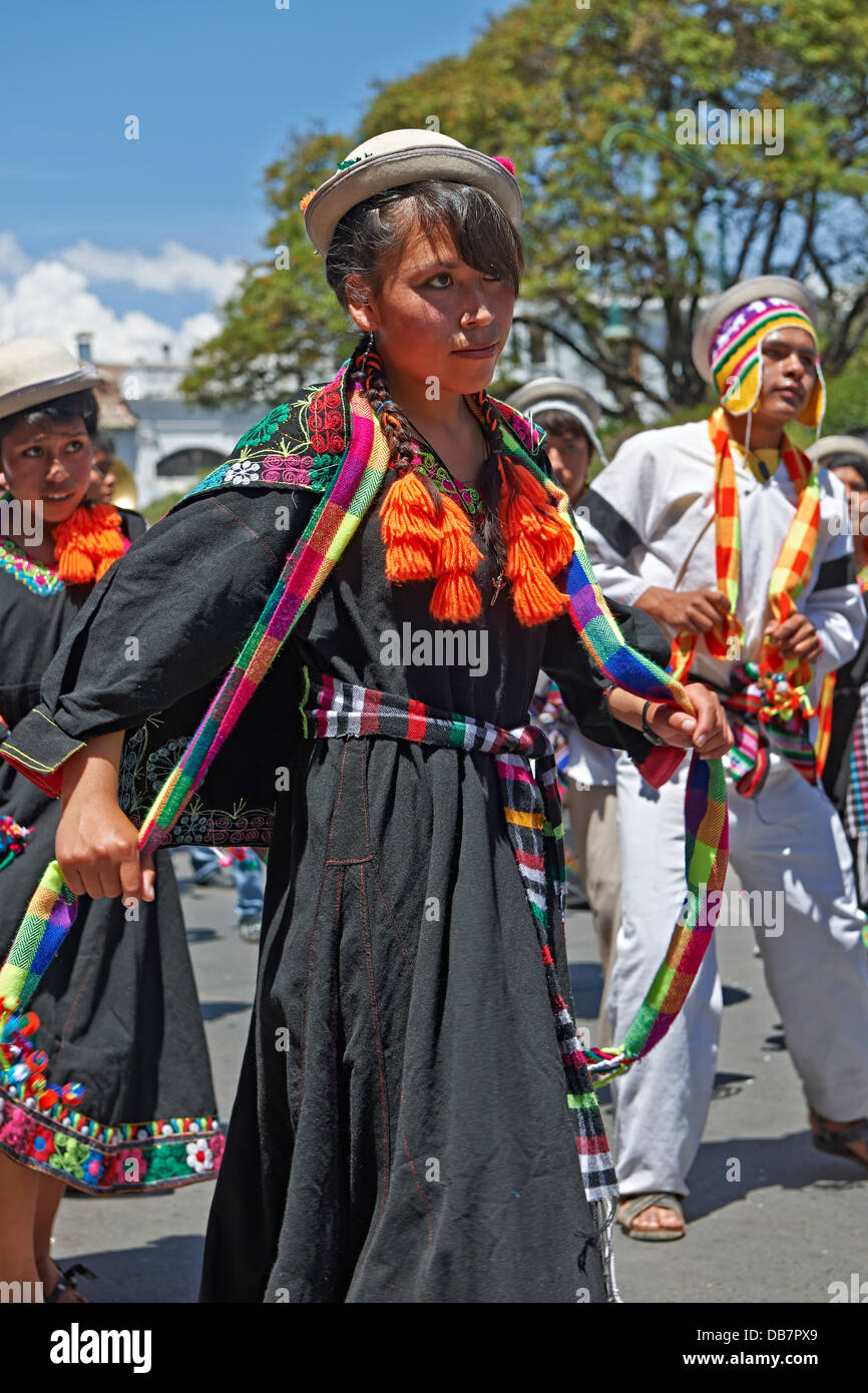 Indigenous People With Traditional Costumes Dancing In The Street Of