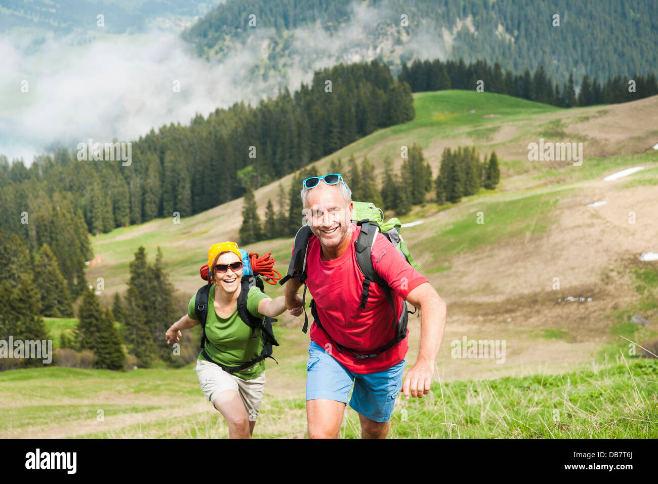 Mature woman hiking with men hi-res stock photography and images - Alamy