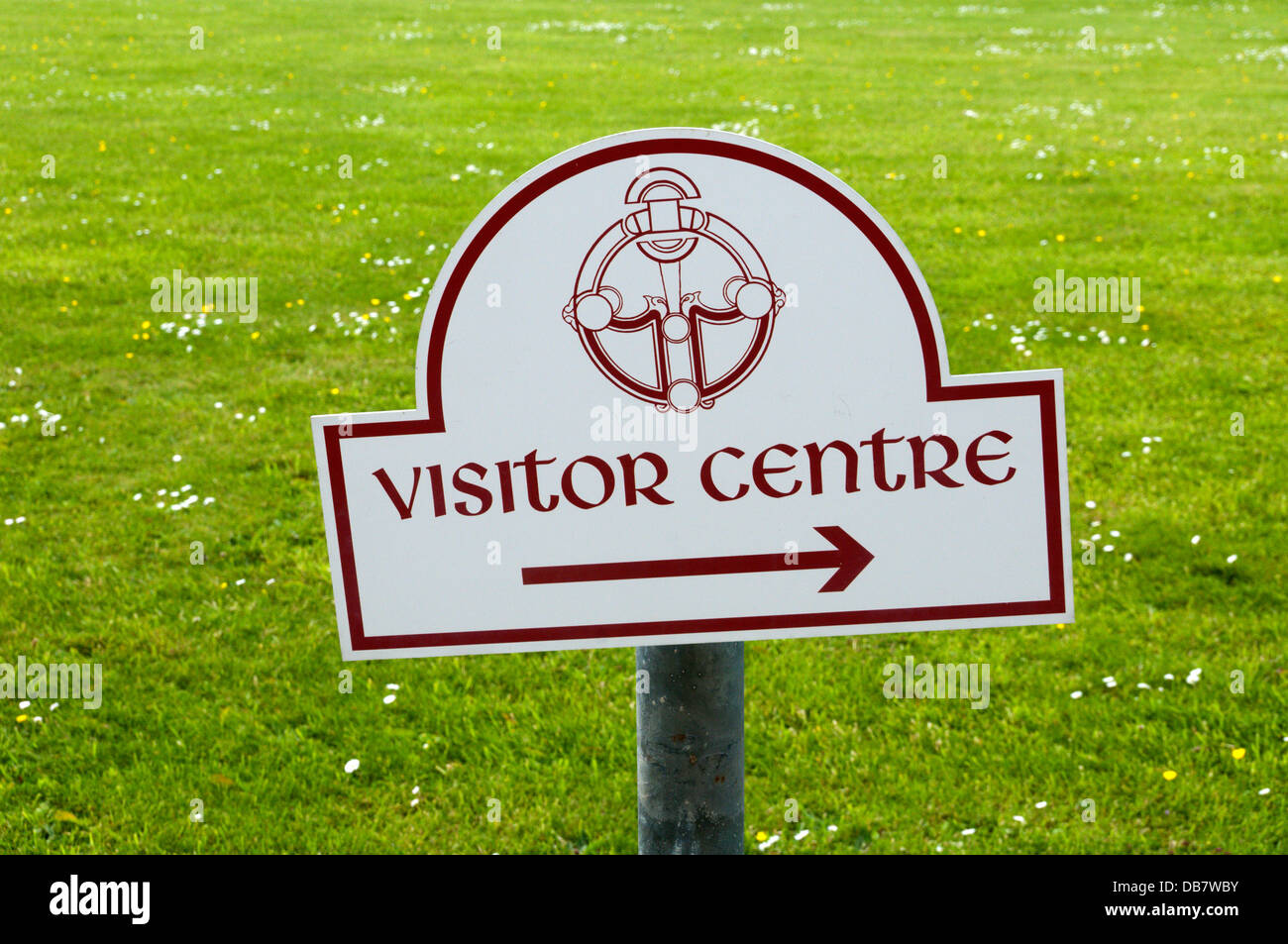 A sign points the way to a visitor centre at a tourist attraction. Stock Photo