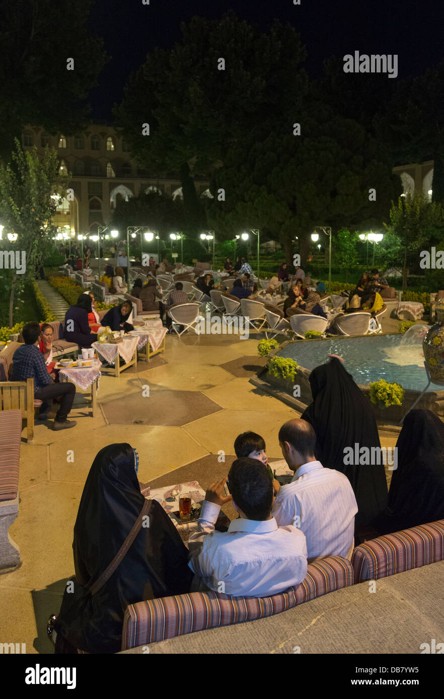 Iranians eating in the Abbasi Hotel, Isfahan, Iran, after breaking their fast during the fasting month of Ramadan Stock Photo
