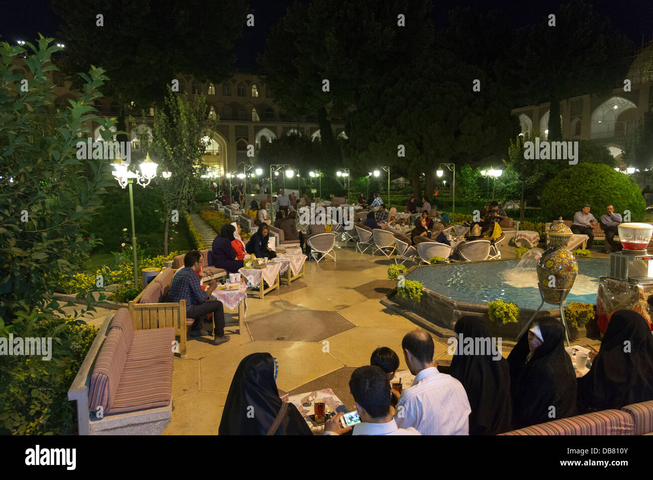 Iranians eating in the Abbasi Hotel, Isfahan, Iran, after breaking their fast during the fasting month of Ramadan Stock Photo