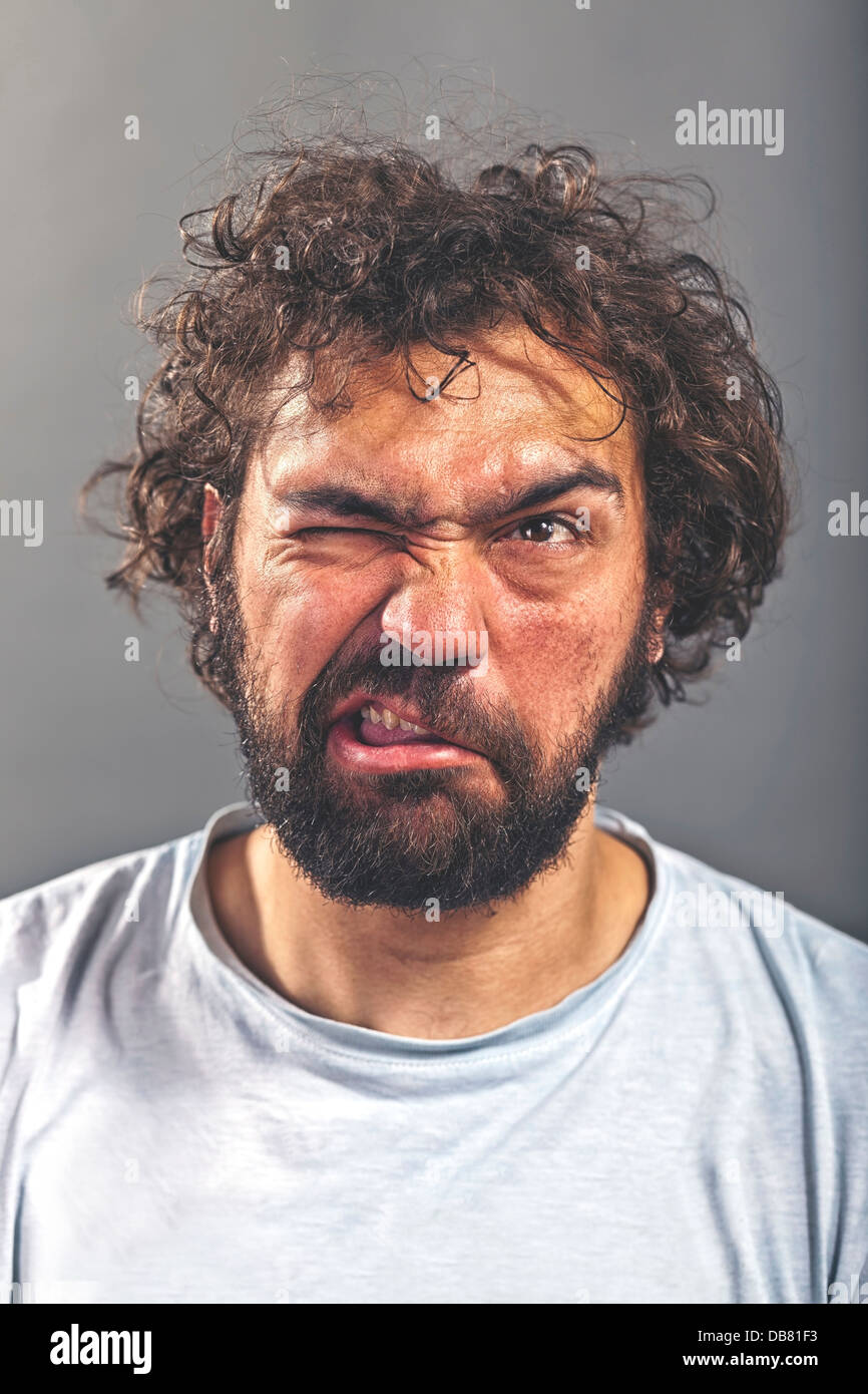 Weird guy making a crazy face Stock Photo