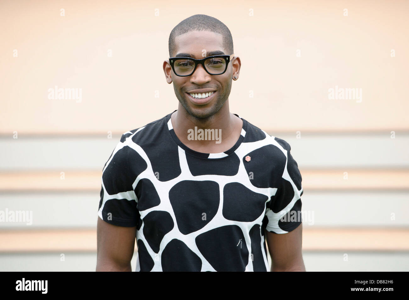 Tinie Tempah arrives for Burberry Prorsum during London Men's spring summer fashion collections 2014, in London. Stock Photo