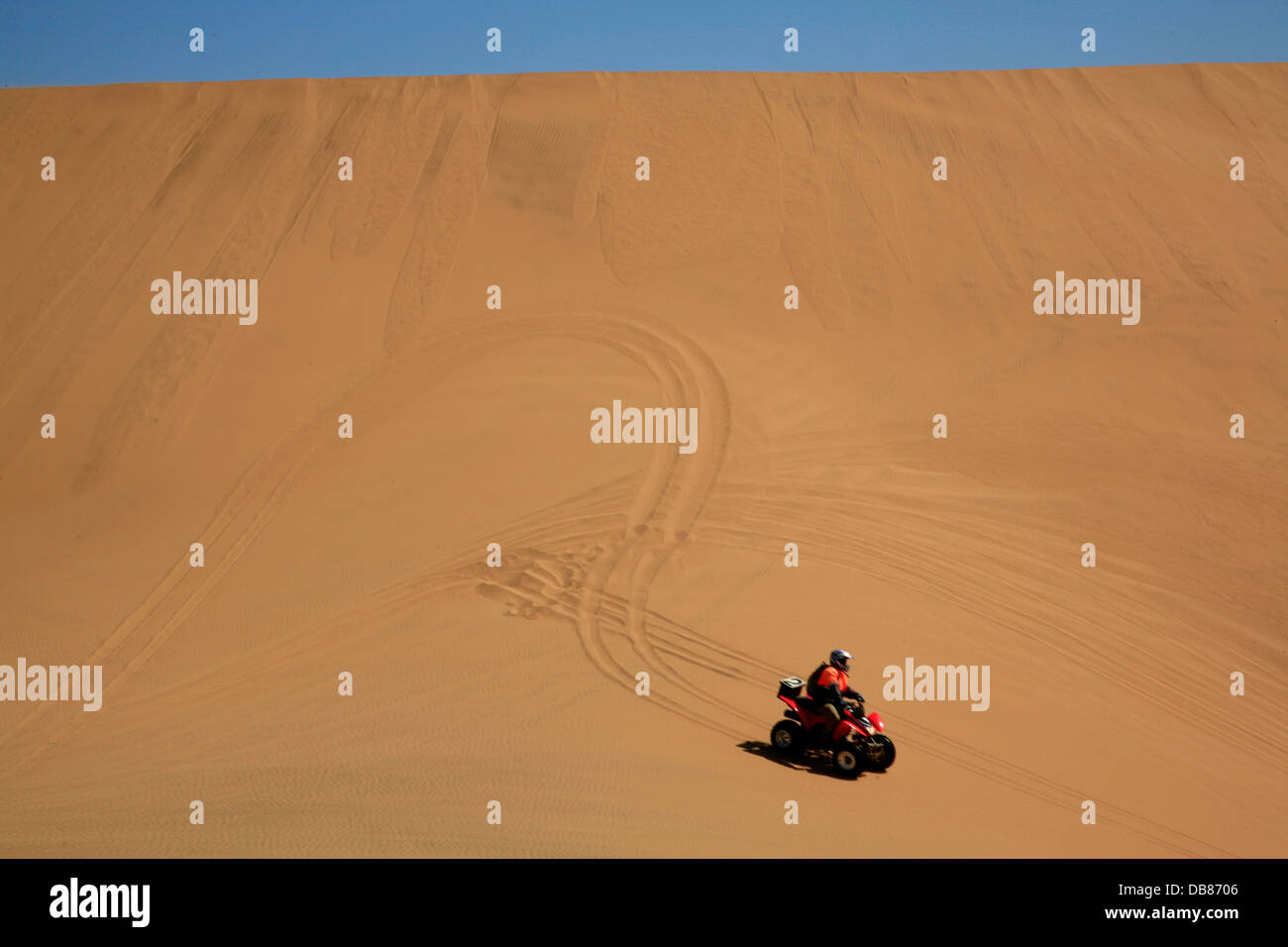 quad biker in the sand dunes near Swakopmund, Namib Desert, Namibia Stock Photo