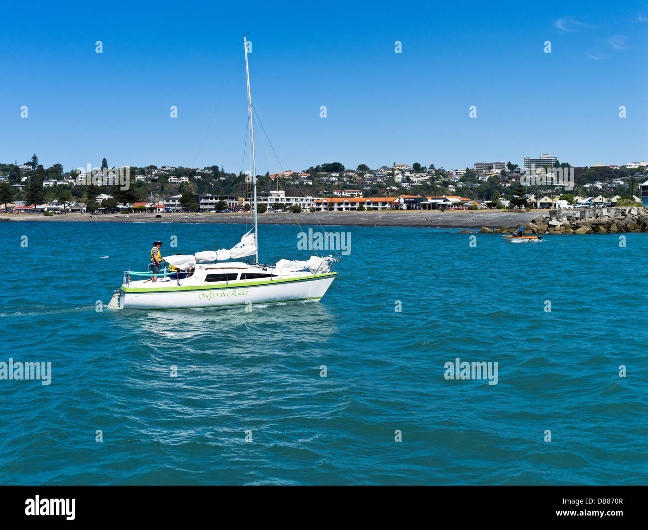 dh Hawkes bay NAPIER NEW ZEALAND Man yacht entering Napier inner harbour boats sailboat sailing leisure Stock Photo