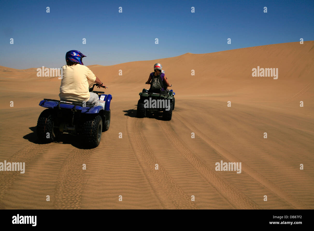 quad biker in the sand dunes near Swakopmund, Namib Desert, Namibia Stock Photo