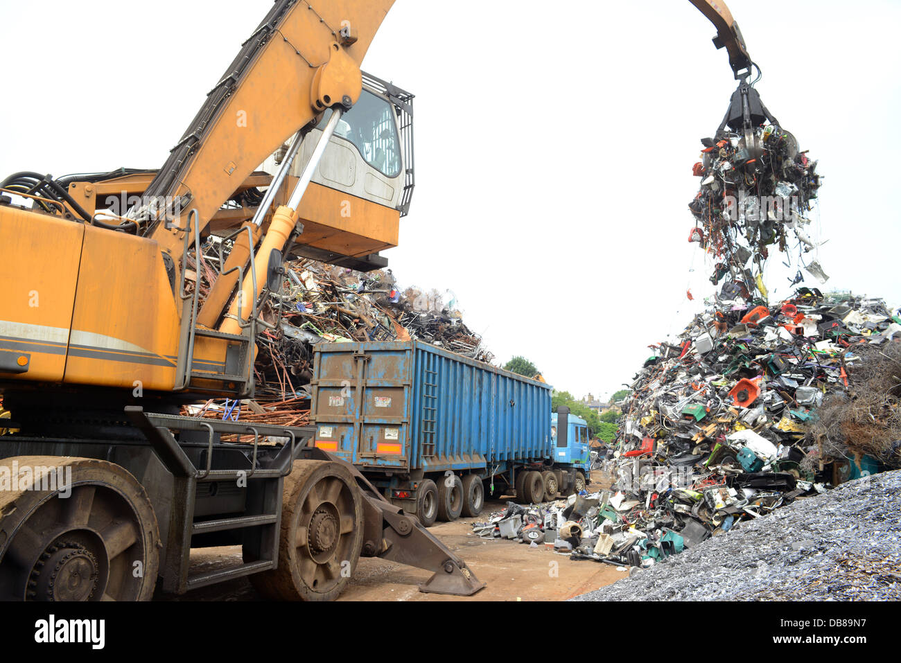 disposal of WEEE waste electronic and electrical equipment being loaded into wagon at processing