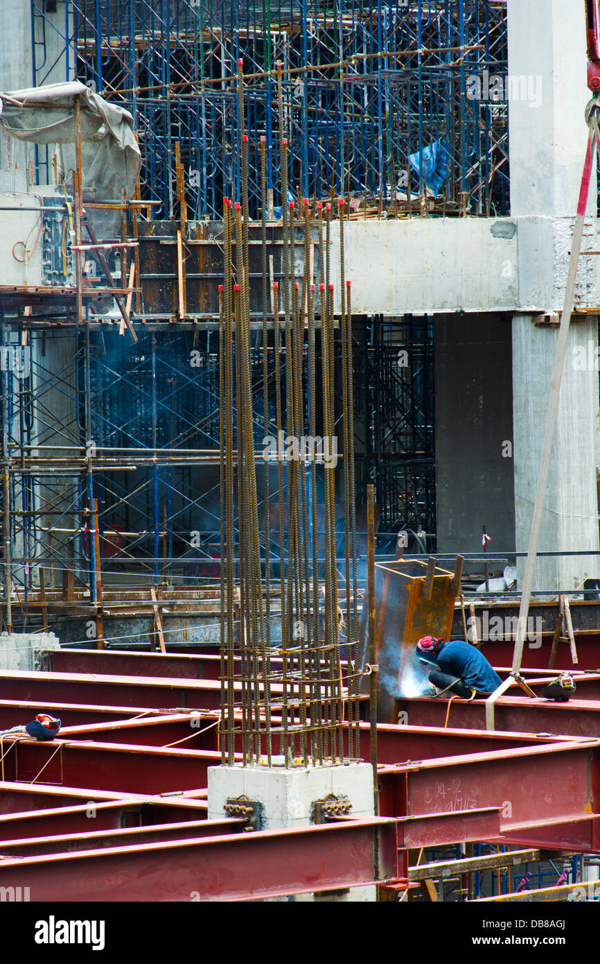 a man welding on a construction site Stock Photo