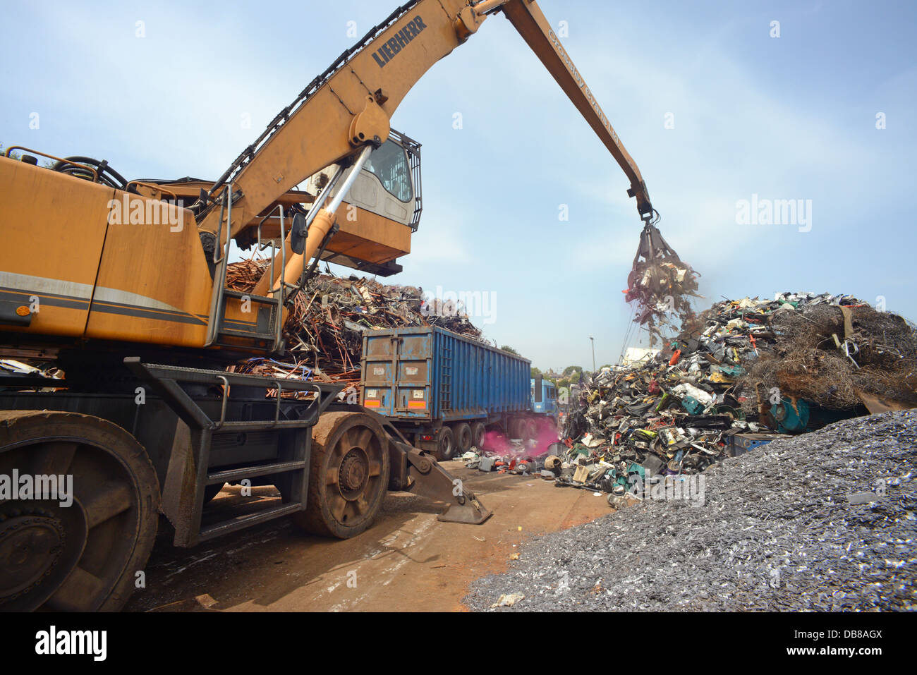 disposal of WEEE waste electronic and electrical equipment being loaded into wagon at processing yard  united kingdom Stock Photo