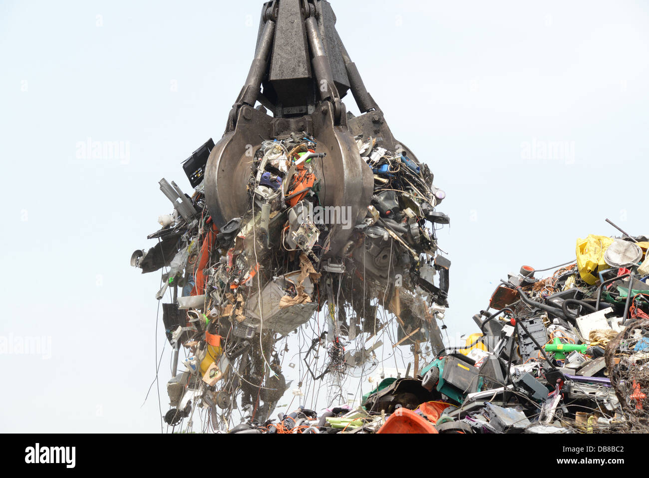 disposal of WEEE waste electronic and electrical equipment being loaded into wagon at processing yard  united kingdom Stock Photo
