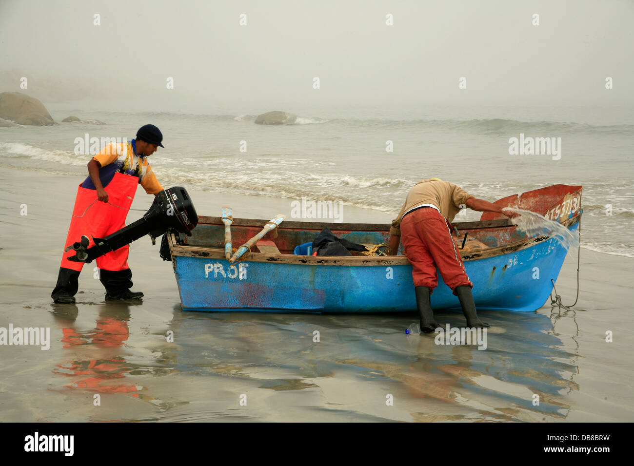 fishermen prepare their boat on a misty morning in Paternoster, West Coast, Western Cape, South Africa Stock Photo