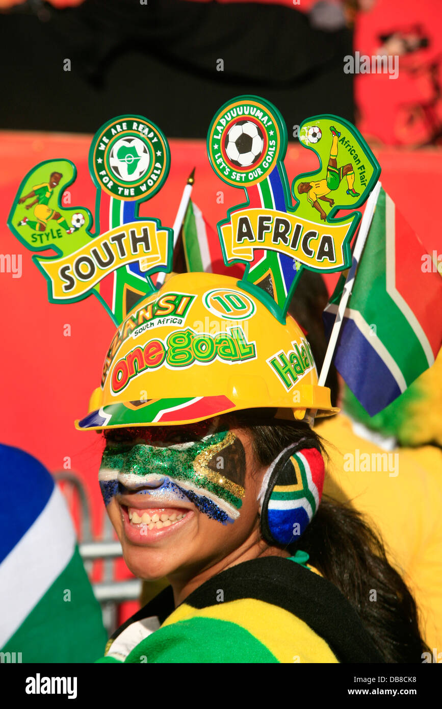 South African fan celebrates Grand Parade fan park pride passion wearing an elaborate head dress in South African colours in Stock Photo