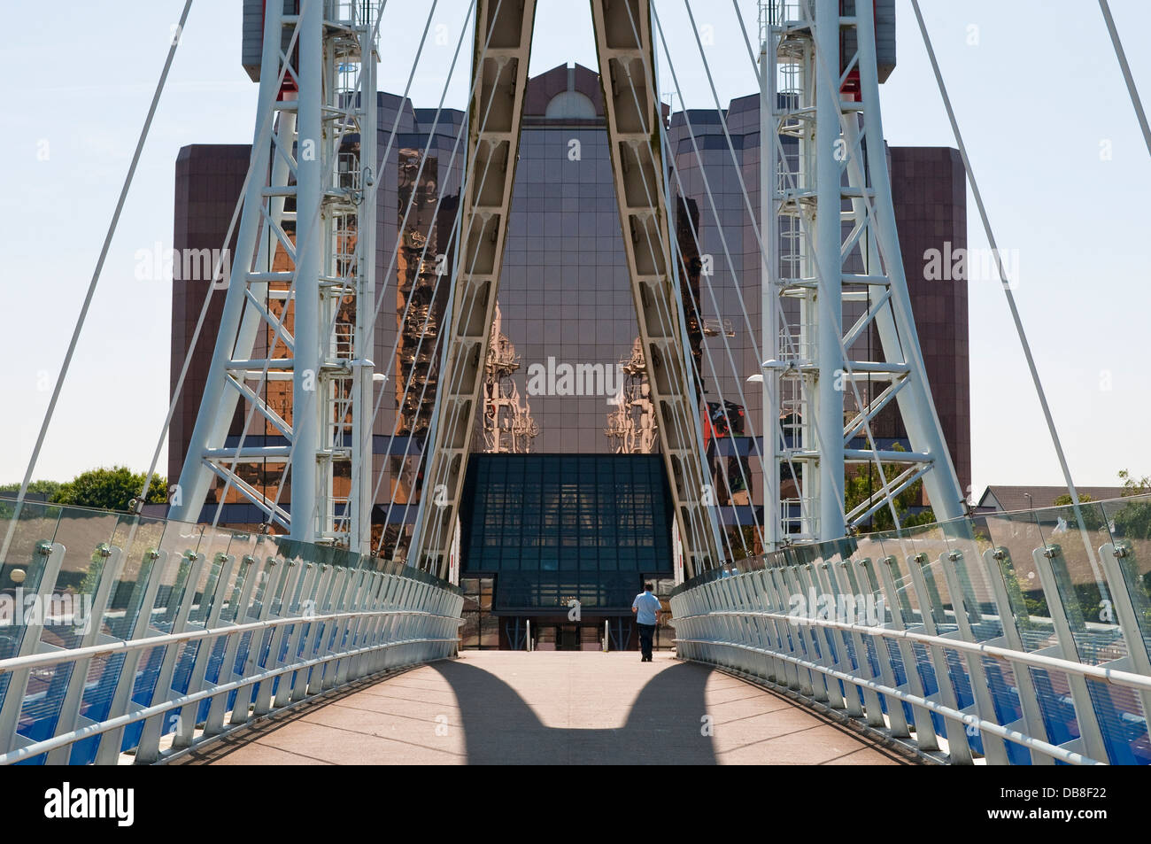 The Lowry footbridge and Copper Glass Building, Quay West Business Centre,, Salford Quays, Greater Manchester, UK Stock Photo