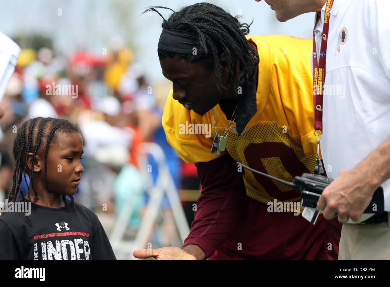 Richmond, Virginia, USA. 24th July, 2013. July 25, 2013: Washington Redskins Quarterback Robert Griffin III #10 greets fans at the Bon Secours training facility in Richmond, Virginia. Daniel Kucin Jr./ CSM/Alamy Live News Stock Photo