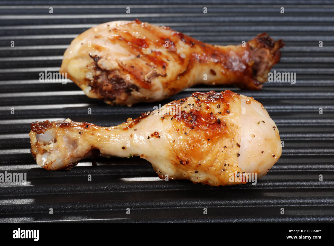 chicken drumstick on grill Stock Photo Alamy
