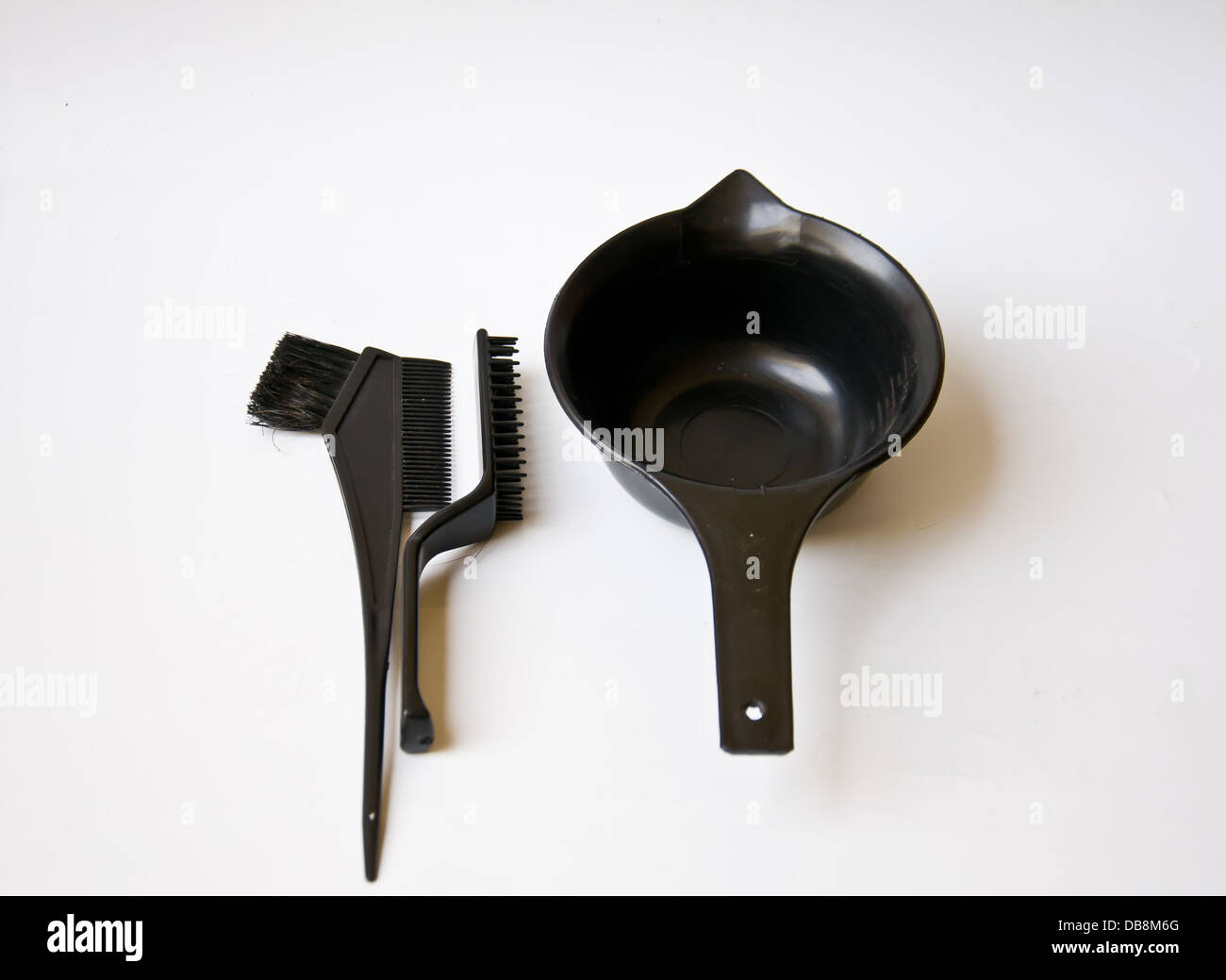 black comb and black bucket on white background Stock Photo - Alamy