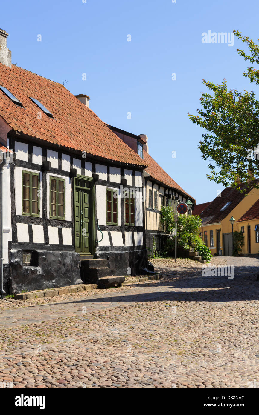 Quaint old houses on narrow cobbled street of Overgade, Ebeltoft