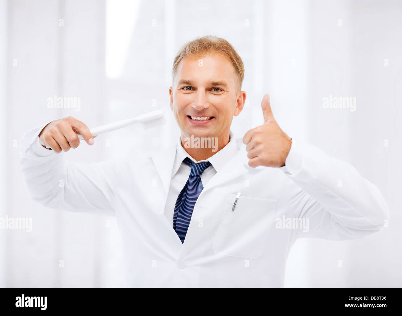 dentist with toothbrush in hospital Stock Photo Alamy