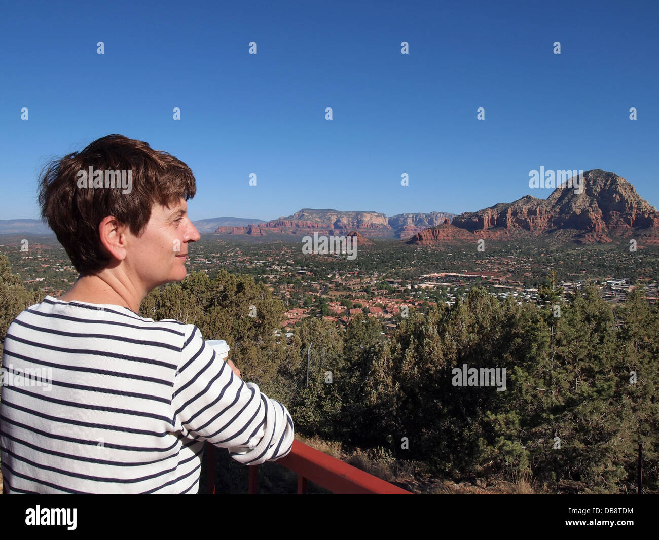 Woman enjoying the view from a tourist outlook in Sedona, Arizona, USA Stock Photo
