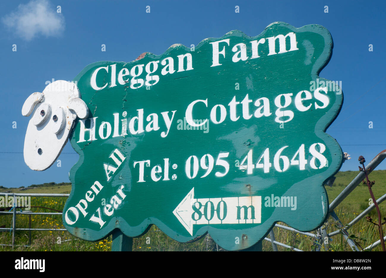 Humorous wooden sign in shape of sheep advertising holiday cottages Cleggan Connemara County Galway Eire Republic of Ireland Stock Photo