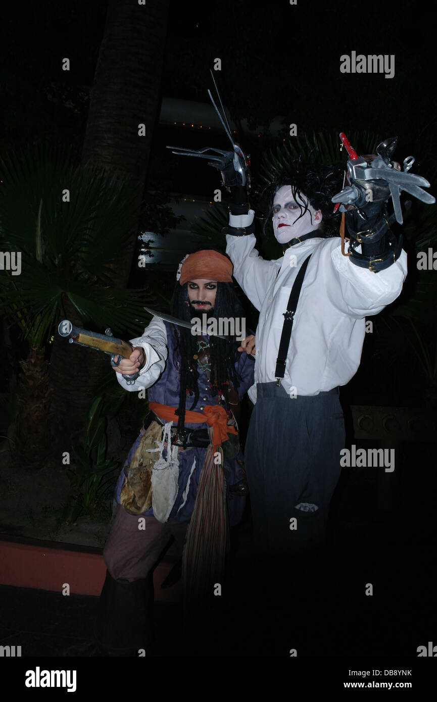 Night flashlight portrait street entertainers dressed as Edward Scissorhands and Captain Jack Sparrow, Harrah's, Las Vegas Strip Stock Photo
