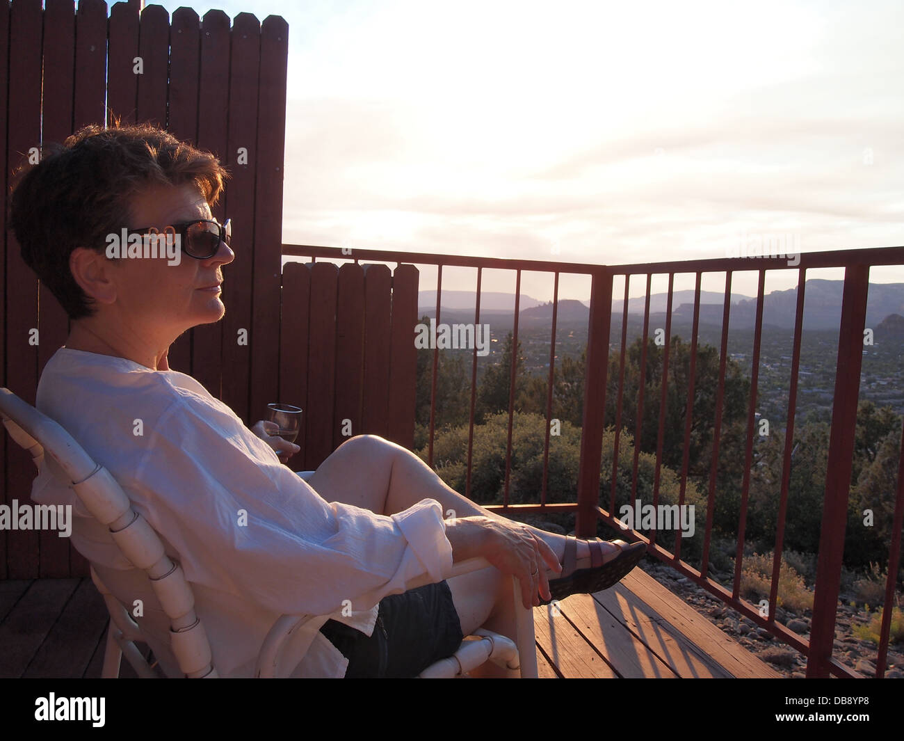 Woman enjoying the view from a deck in Sedona, Arizona, USA Stock Photo