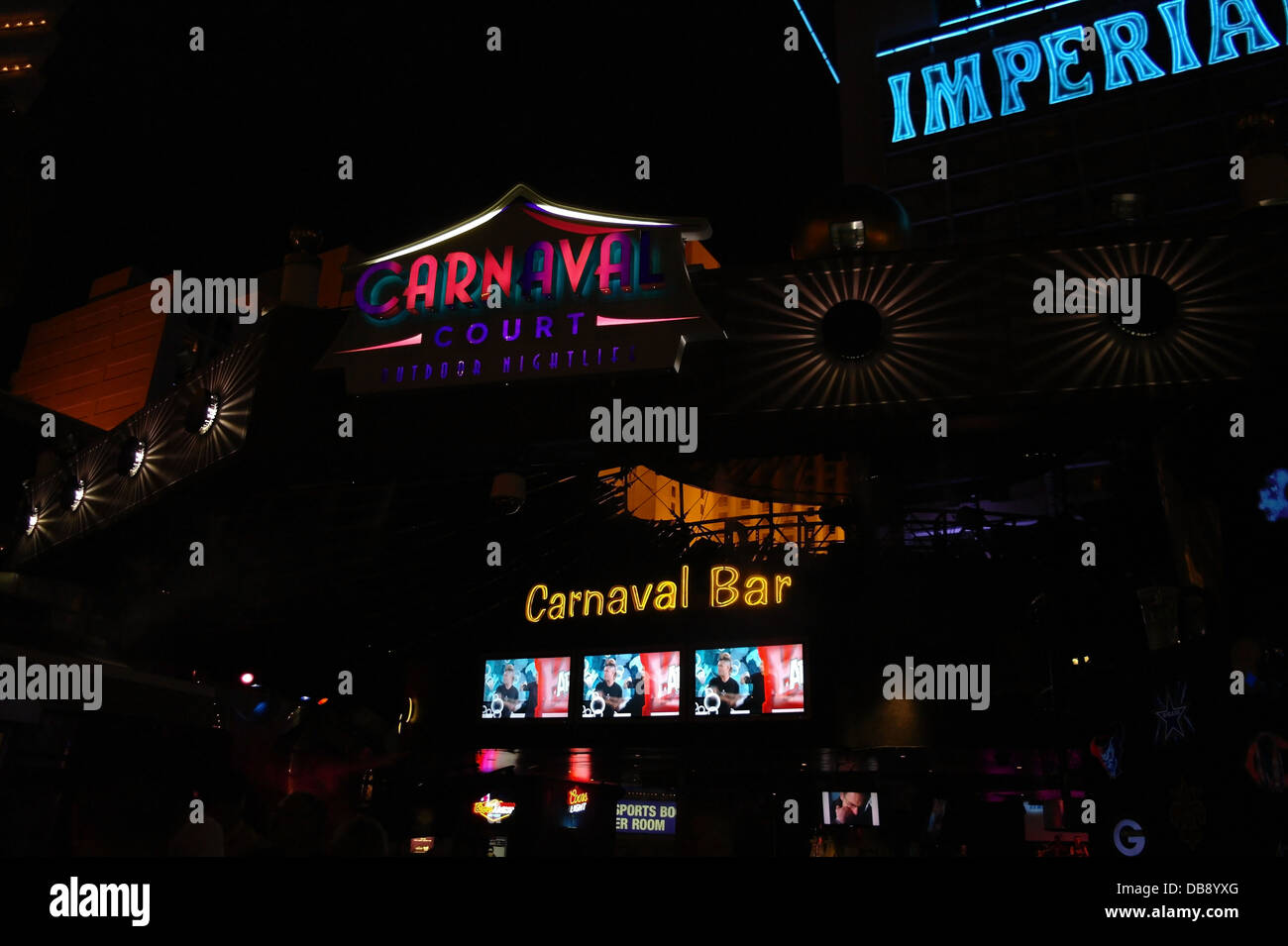 Night neon view pink yellow Carnaval Court and Carnaval Bar signs in