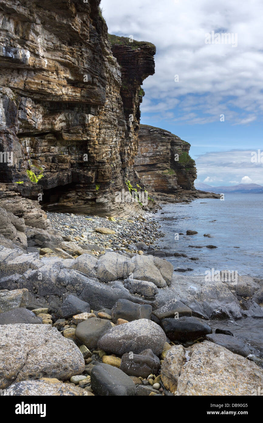 HDR image of sea loch, rocky beach and eroded cliffs, Glasnakille near Elgol, Isle of Skye, Scotland. Stock Photo
