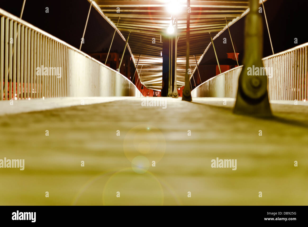 metal bridge with bright lights at night Stock Photo Alamy