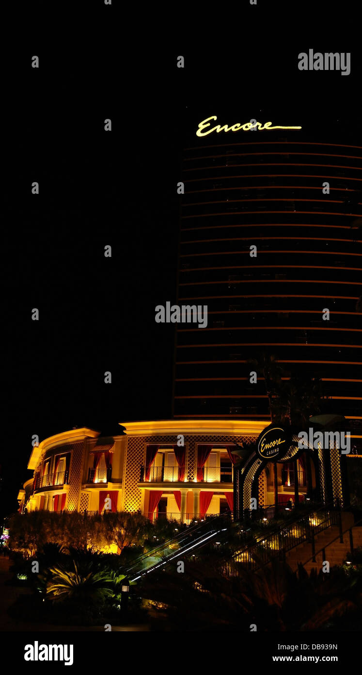 Night portrait, to electric lights hotel tower, tiered garden stairs rising Encore Casino, Encore Resort, Las Vegas Strip, USA Stock Photo